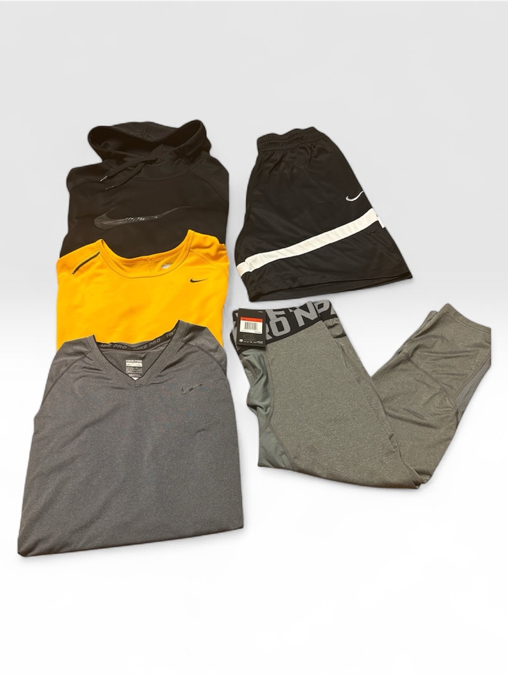 Five Piece Nike Men’s Activewear Set - Black, Yellow, Gray. All are large.